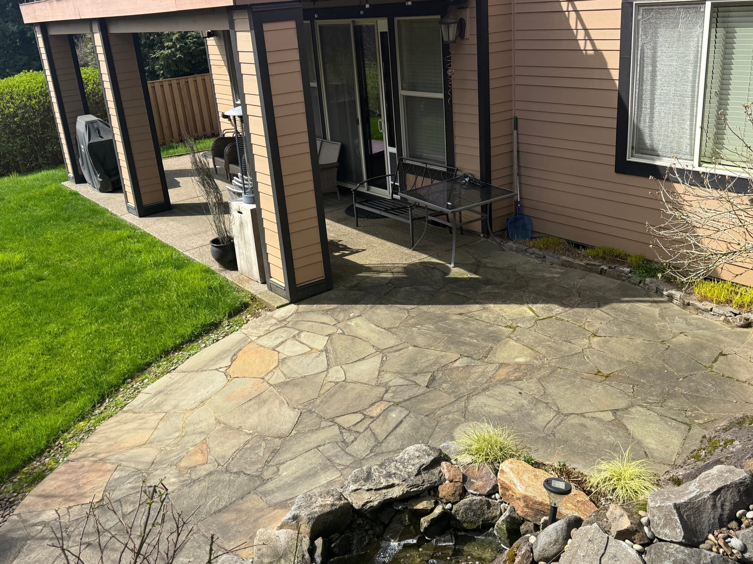 Flagstone patio after moss removal and cleaning.